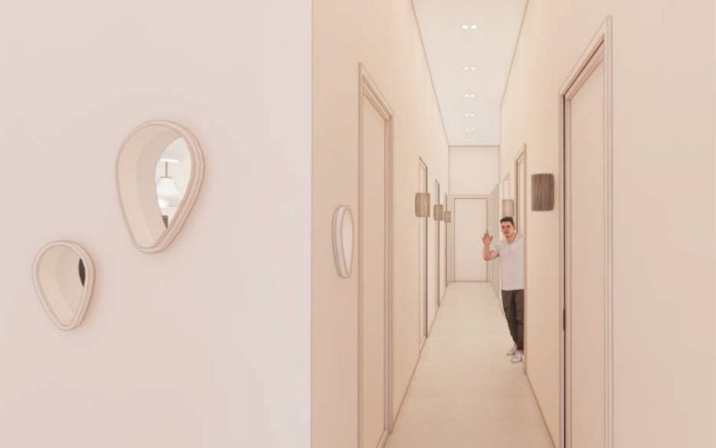 Modern dental clinic hallway with a smiling patient giving a thumbs-up.