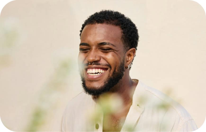 Happy man smiling with white teeth, showcasing dental health and confidence.